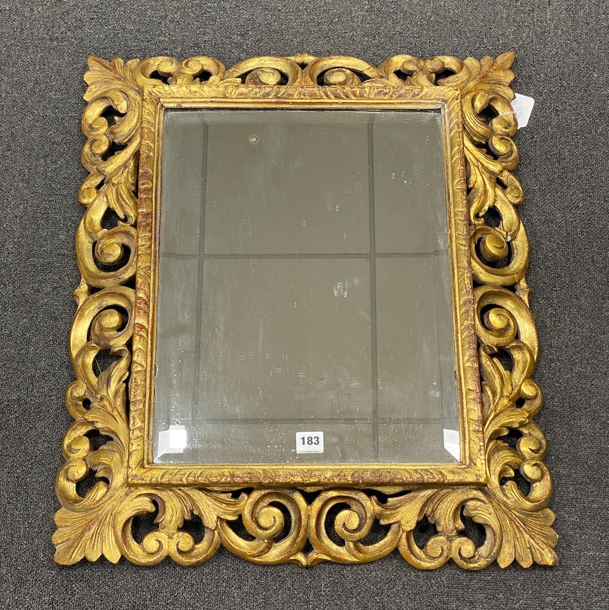 A 19th century French carved giltwood wall mirror, width 58cm, height 68cm